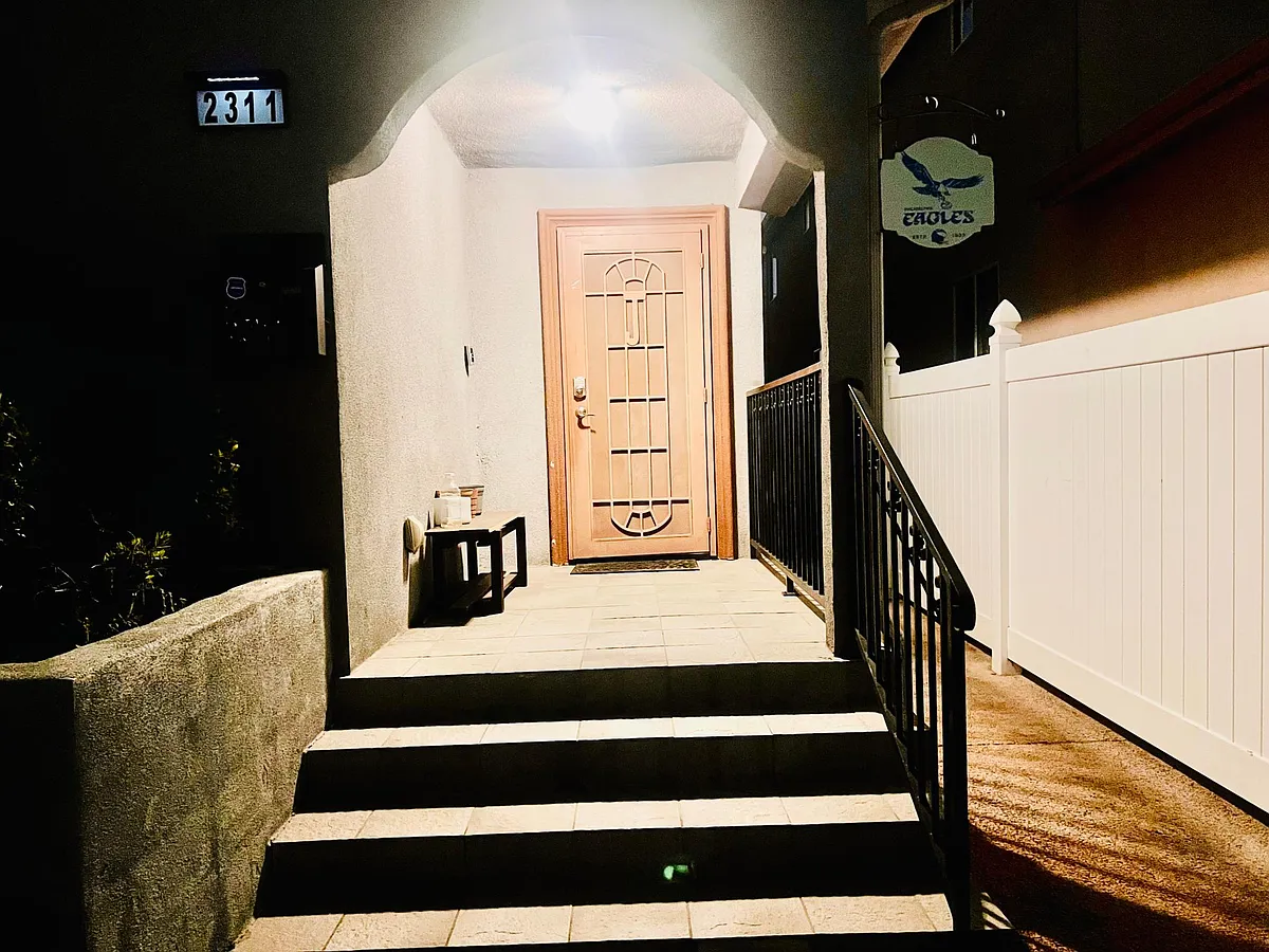 Light on Porch w/ steps leading to Front door w/ Security gate, Ring doorbell camera, Exterior camera facing the street. - W Lincoln St