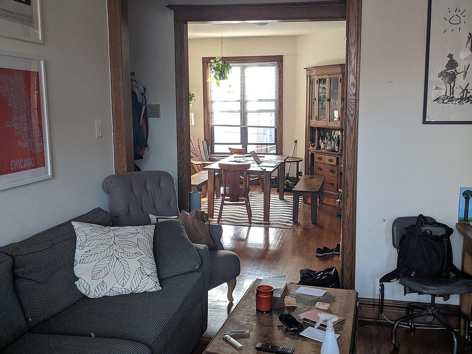 Standing in living room looking into dining room.