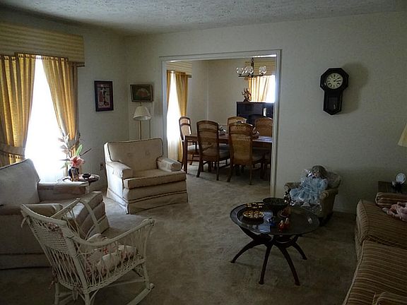 Formal Living and Dining area with plush carpeting
