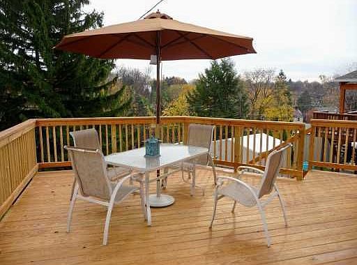 Well-designed custom deck overlooks the back yard; great view of fireworks!