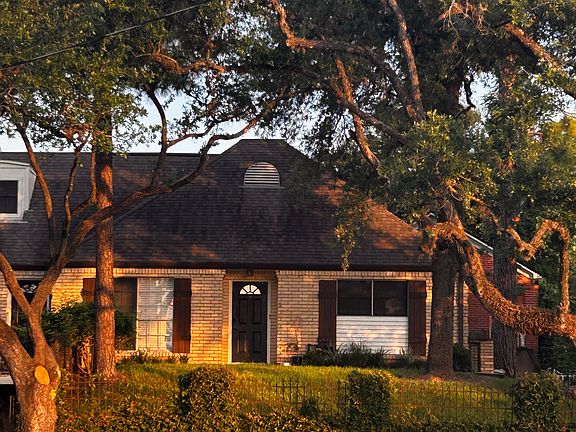 welcome to your own treehouse. the elevated placement of the home makes every window view a canopy view from the surrounding mature trees-beautiful!