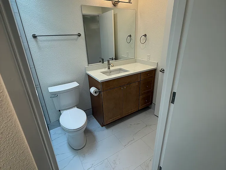 All bathroom and vanity counters are built to the height of kitchen counters, not the lower standard bathroom height.