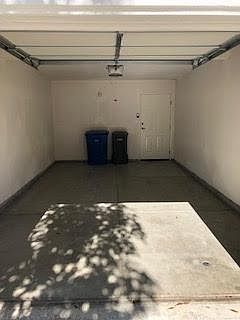 Large private attached one car garage is under unit. Back door to stairway leading to unit