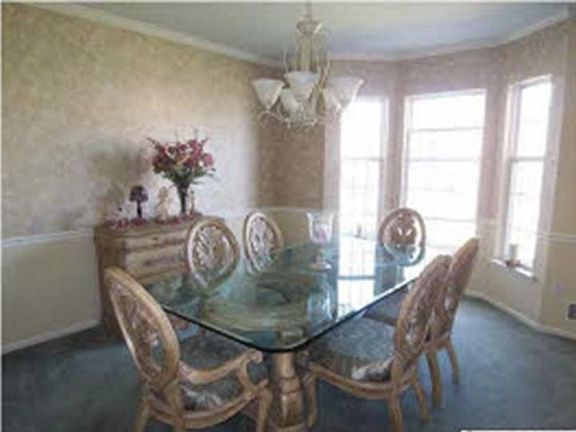Formal Dining Room with decorative moulding