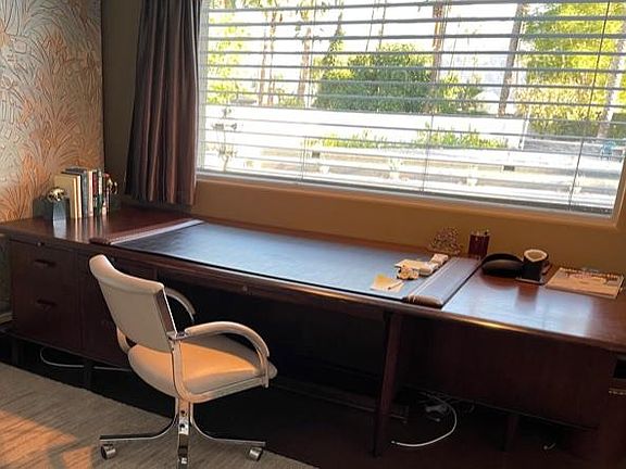 9' mahogany desk by Monteverdi Young in office - great view window of tennis court and yard