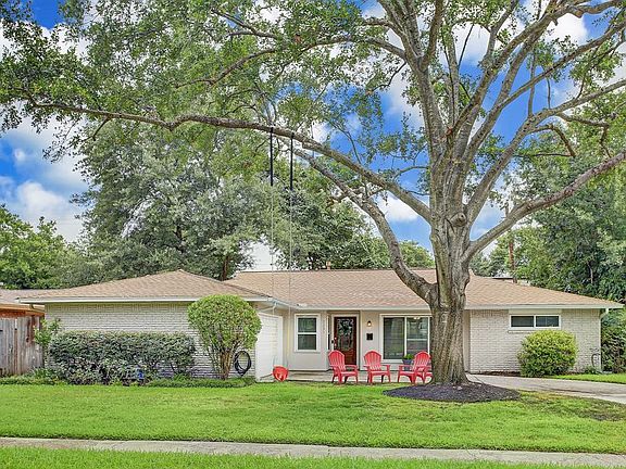 The stately, mature oak tree creates an inviting environment for this lovely home. Per Seller, no flooding during Harvey.