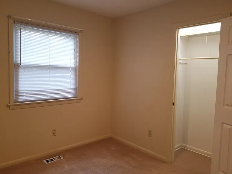 3rd bedroom from inside.
Window in picture is from previous pic (faces street).
3rd bedroom closet with light.