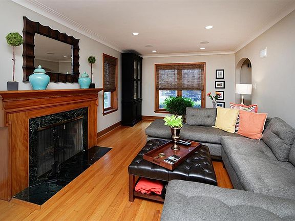 Rich wood detail and natural light imbue this home with a warm ambiance.