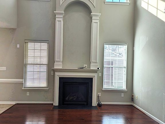 Vaulted living room with cable hook-ups above the fireplace for a TV