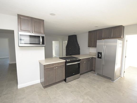 REMODELED KITCHEN WITH BREAKFAST BAR