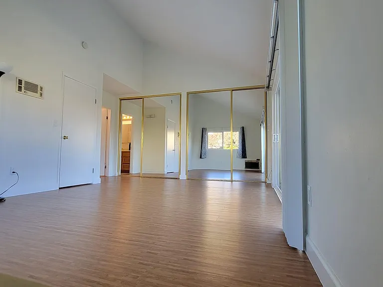 Master bedroom has 14ft tall vaulted ceiling, en suite bathroom, separate His and Hers closet.