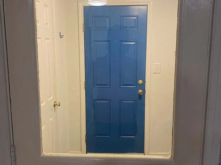 Exterior Door of Kitchen (with upper window) leads to laundry patio also with an Exterior Door (blue) for extra security.