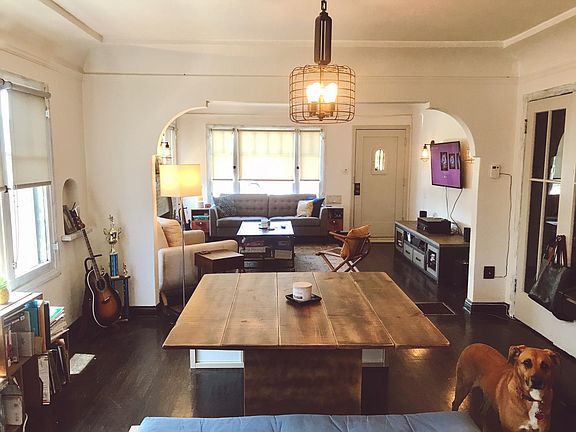 Living room and dining taken from kitchen* (*this picture is from the OTHER unit in the duplex when it was furnished. NOT the actual unit.. The two units are nearly identical. Unit will NOT be furnished )