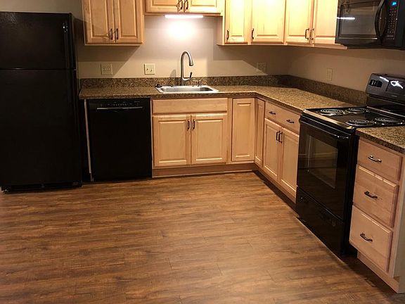 Kitchen with all appliances to the right as you enter the apartment