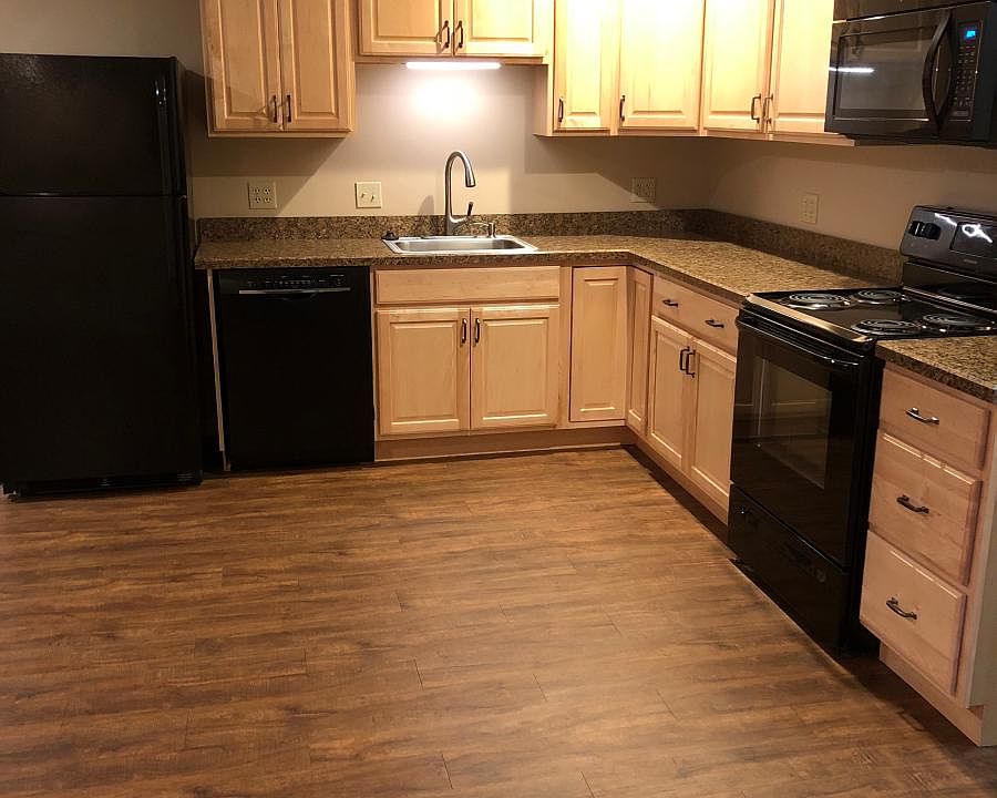 Kitchen with all appliances to the right as you enter the apartment