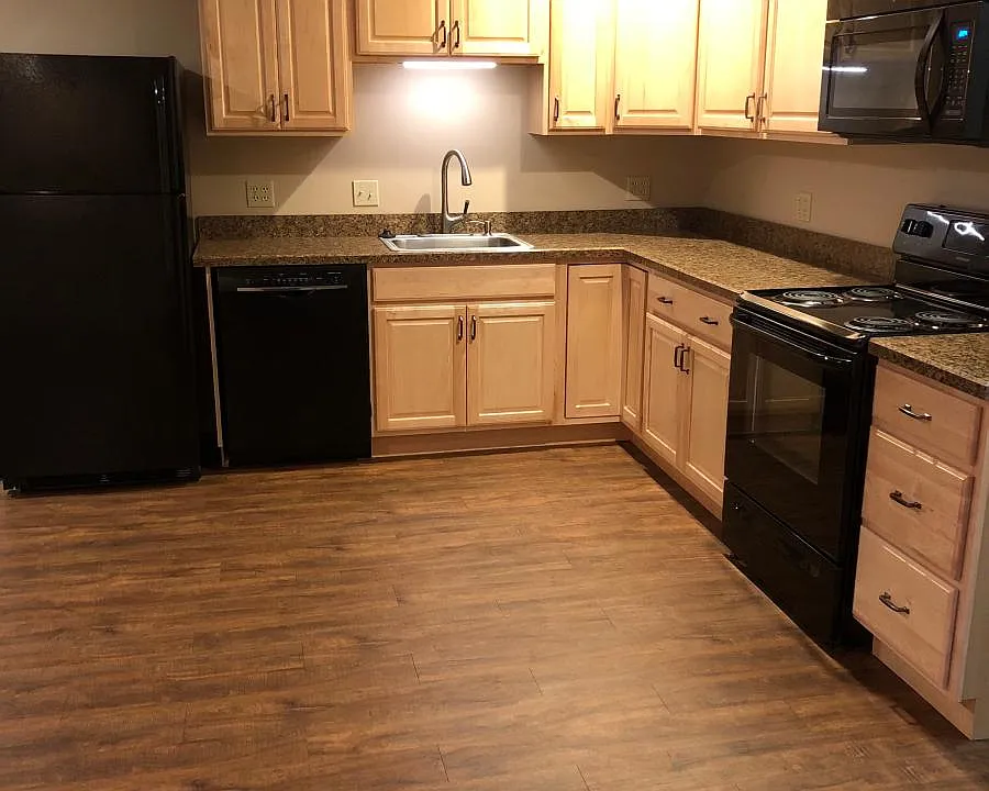 Kitchen with all appliances to the right as you enter the apartment