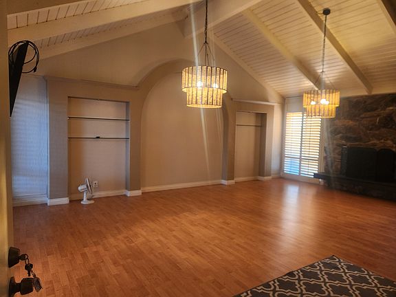 living space with fireplace on right