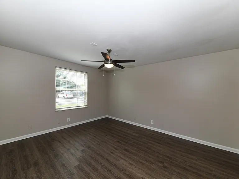 Bedroom with hardwood-style flooring
