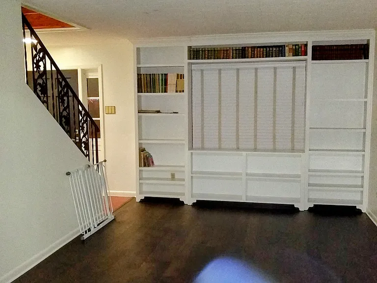 Living room with built in bookshelf.