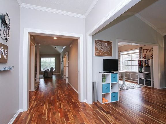 WOW is what you will say when you walk into this warm and inviting home and see the gorgeous unique wood floors.   This two story Lakewood Forest beauty has a central two story family room which is the heart of the home, a study or formal living room, formal dining room with gorgeous built ins, and a private and spacious first floor master suite with large master bath and loads of closet space!