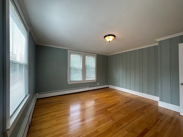 Generous primary bedroom with closet and natural light