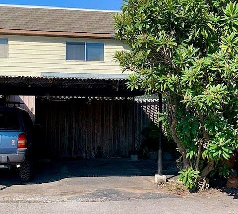 Locked wood gated patio perfect for outdoor dining table with privacy and extra security.