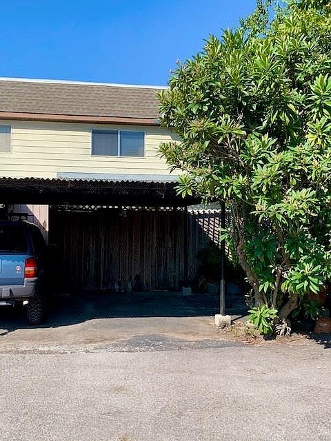 Locked wood gated patio perfect for outdoor dining table with privacy and extra security.