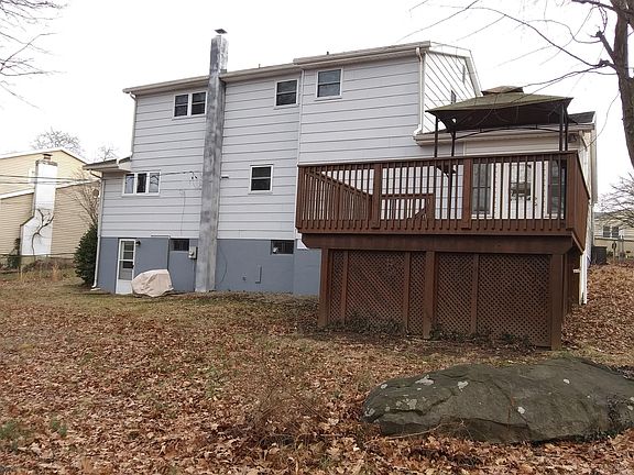 Back of house with elevated deck