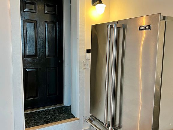 Viking fridge, custom tile pantry/entryway.