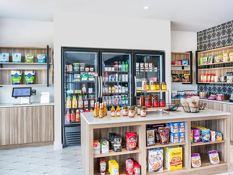 Experience convenience around the clock at Modera EaDo's 24-hour to-go marketplace, offering a wide selection of food, beverages, and everyday essentials.