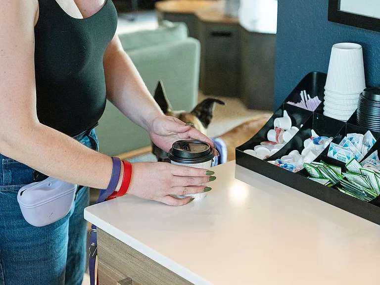 The clubhouse includes a complementary coffee station for residents.