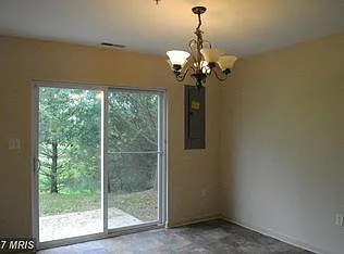 Dining area opens to patio and community green space.