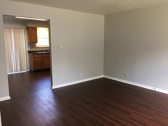 In the living room. Seeing into the kitchen.