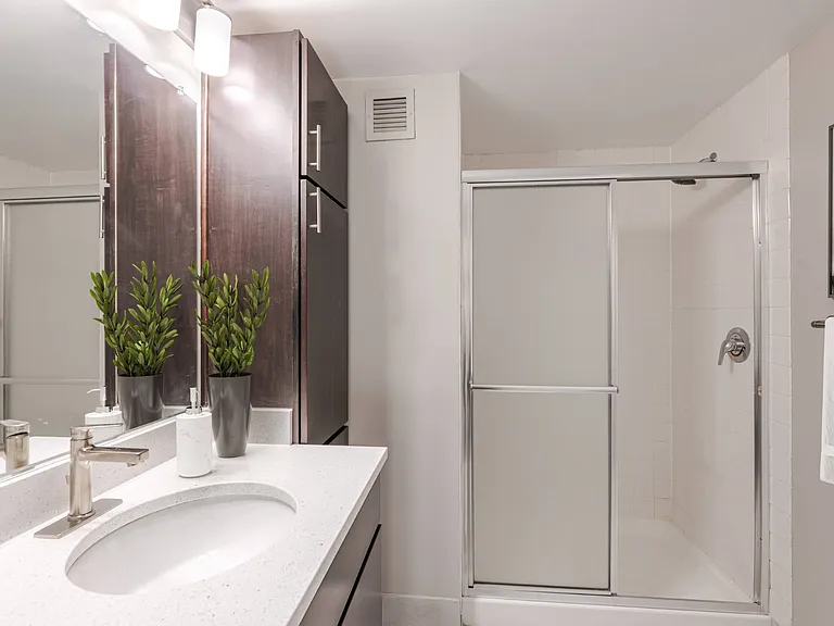 Bathroom with Plenty of Storage at 15 Bank Apartments in White Plains, NY 10606