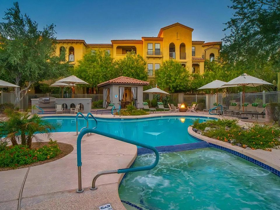 Swimming Pool Connected to Hot Tub with Poolside Firepit and Umbrellas