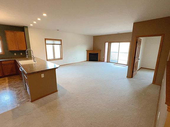 Fireplace and sliding doors that give access to private balcony