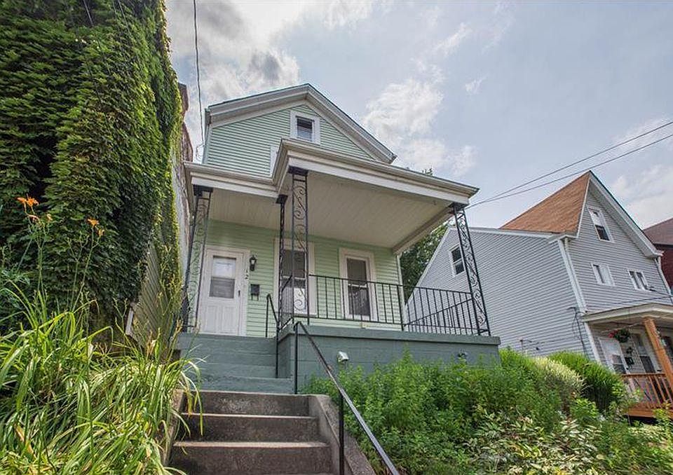 View of house from sidewalk.