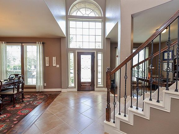 Such a warm and welcoming entryway has natural light and offers a transitional space into the main part of the home.