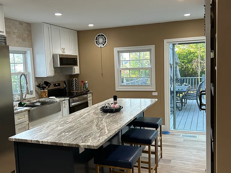 Kitchen with slider to deck