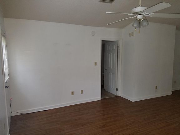 Living room with master bedroom entrance.