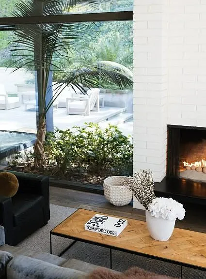 Uncover the living room's distinct design touches, where modern sophistication merges seamlessly with comfort.