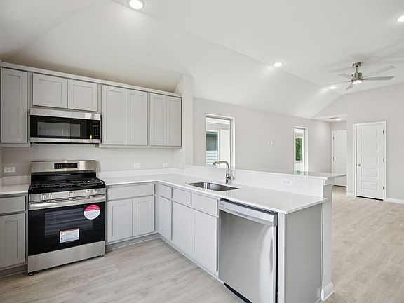 Kitchen in the Pine home plan by Trophy Signature Homes - REPRESENTATIVE PHOTO