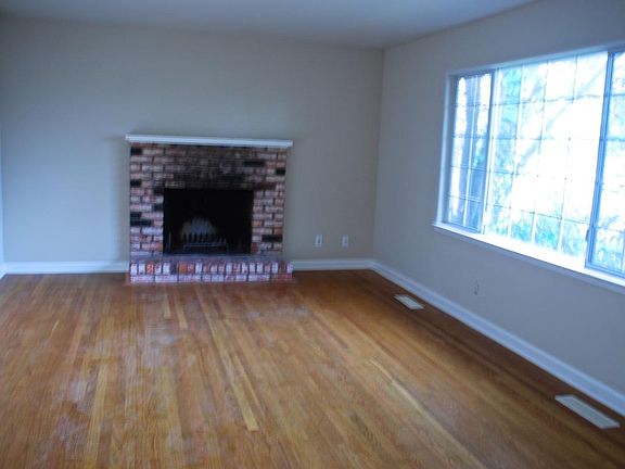 Separate living room with oak floors