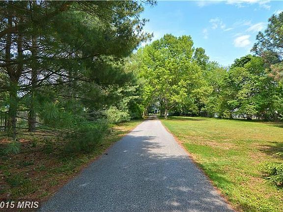 Tree-Lined Drive Leads to aWater Front Retreat.