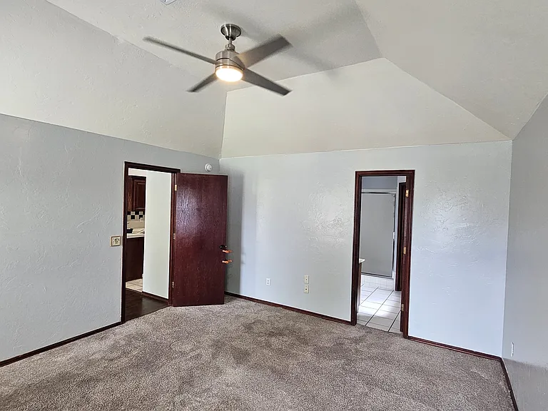 Master looking into on-suite bathroom and master closet