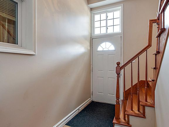 Front Entrance. First floor laundry and lower level bathroom