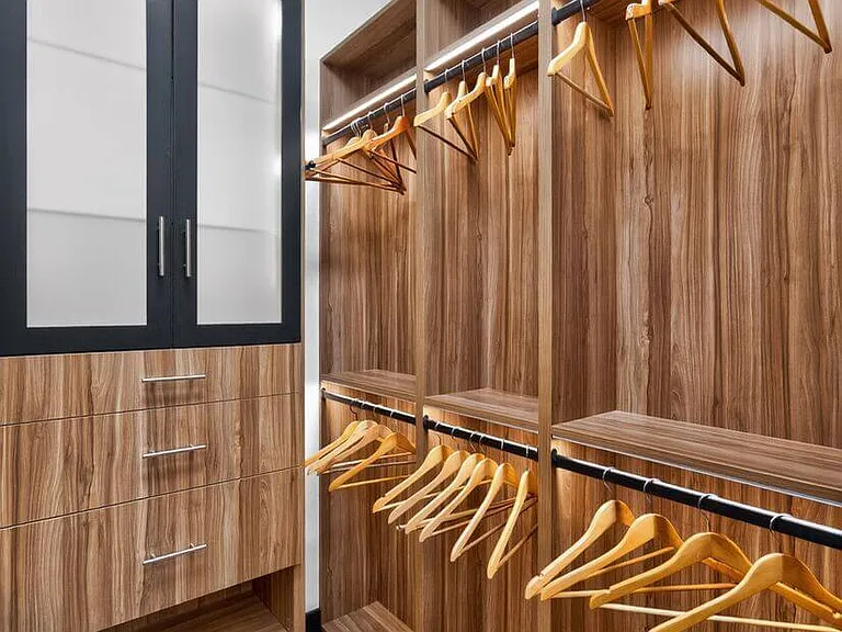 Custom boutique inspired walk in closet with led lighting