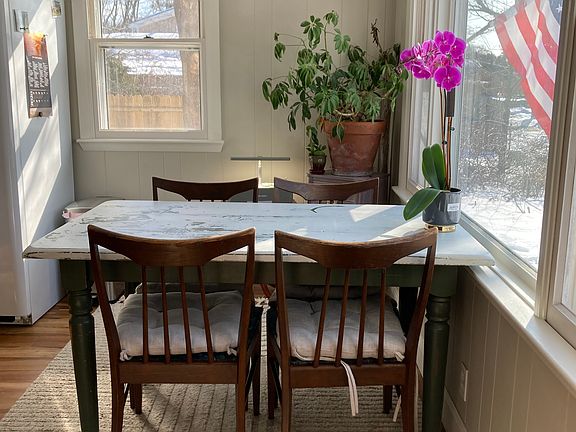 Sunny dining area in kitchen, new 6 foot privacy fence outside of window that extends the entire length of property