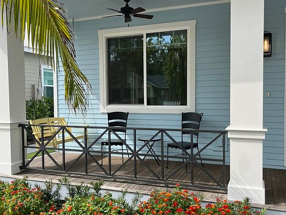 awesome front porch with porch swings and seating