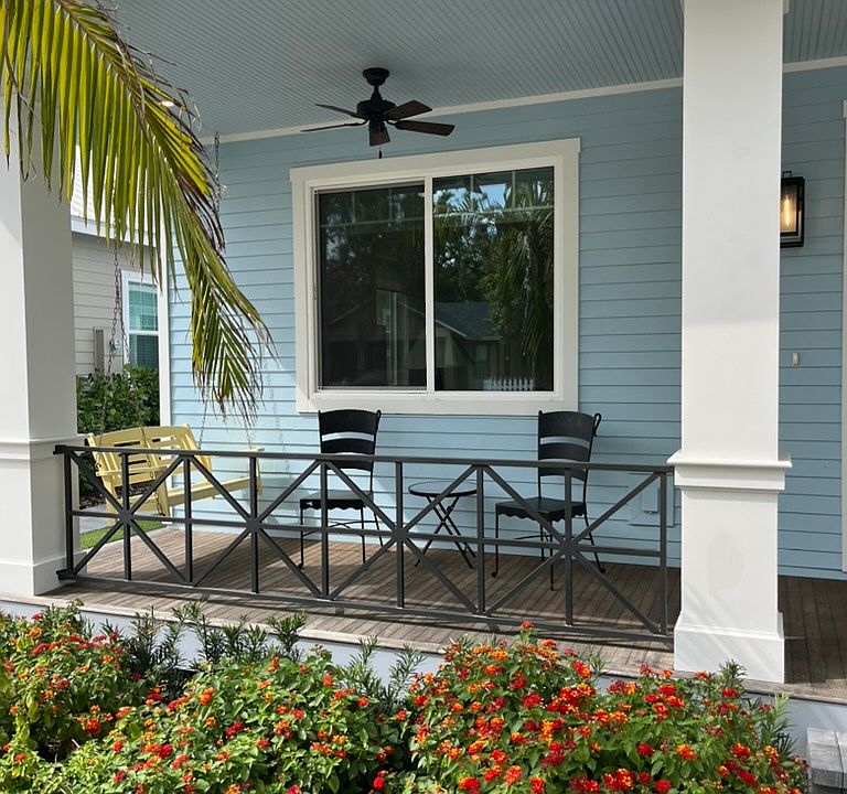 awesome front porch with porch swings and seating